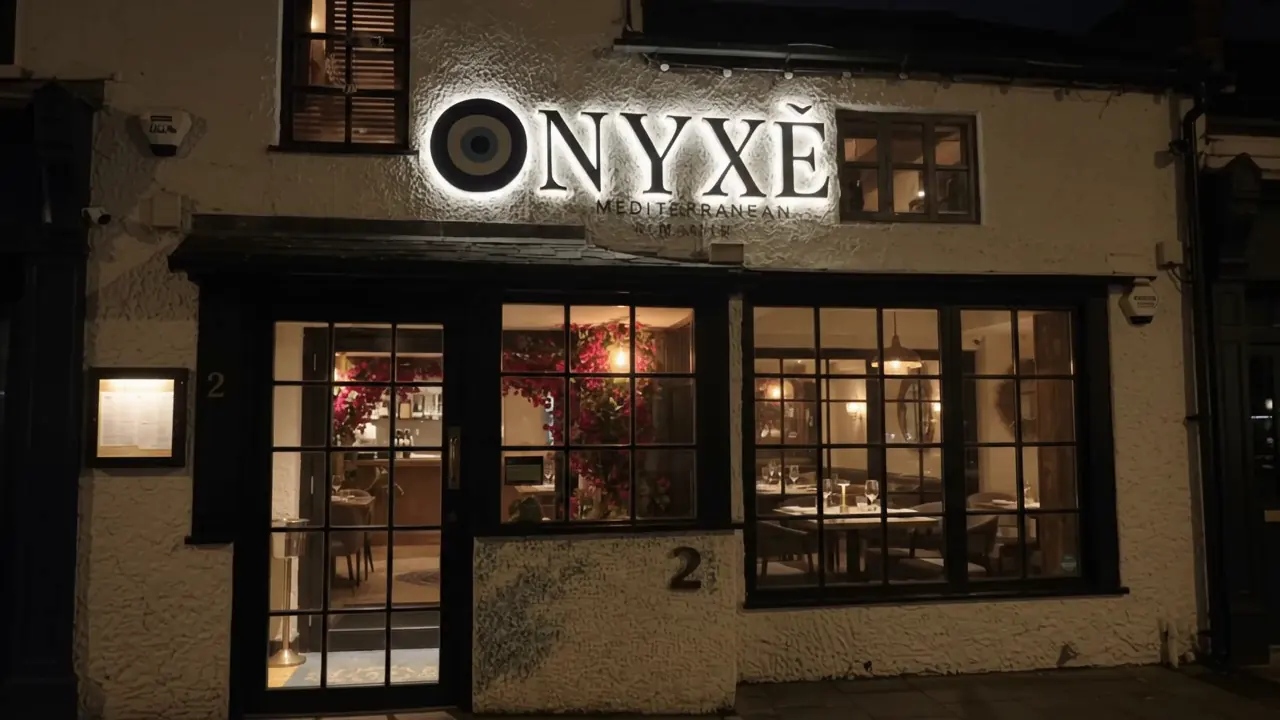 The restaurant exterior illuminated at night