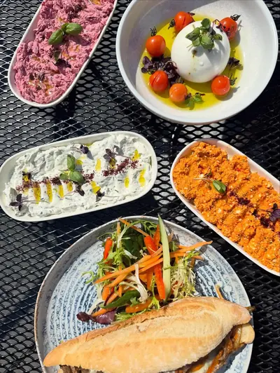 Colourful NYXE mezze with hummus, burrata and warm bread